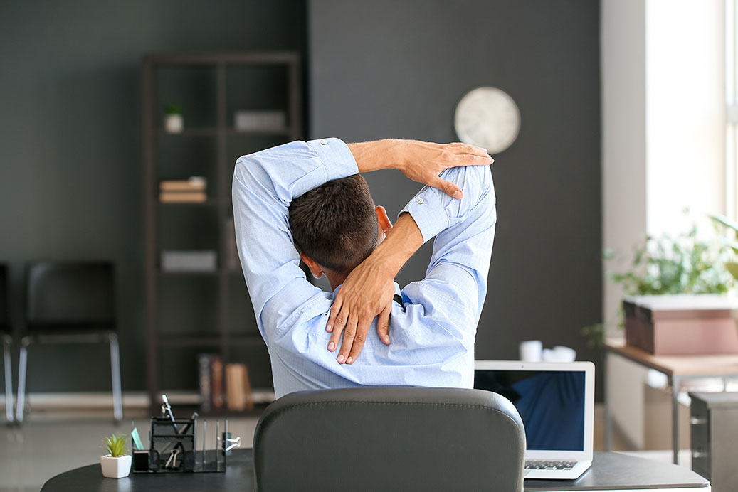 office worker taking break and stretching